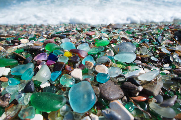 Beach fully covered with multicolored glass pebble. Wonder of nature. Robotics GPS